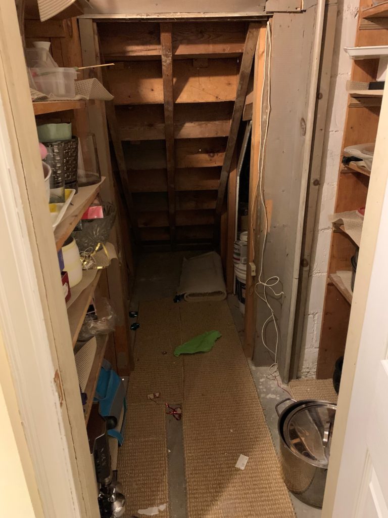 Untidy area under the stairs